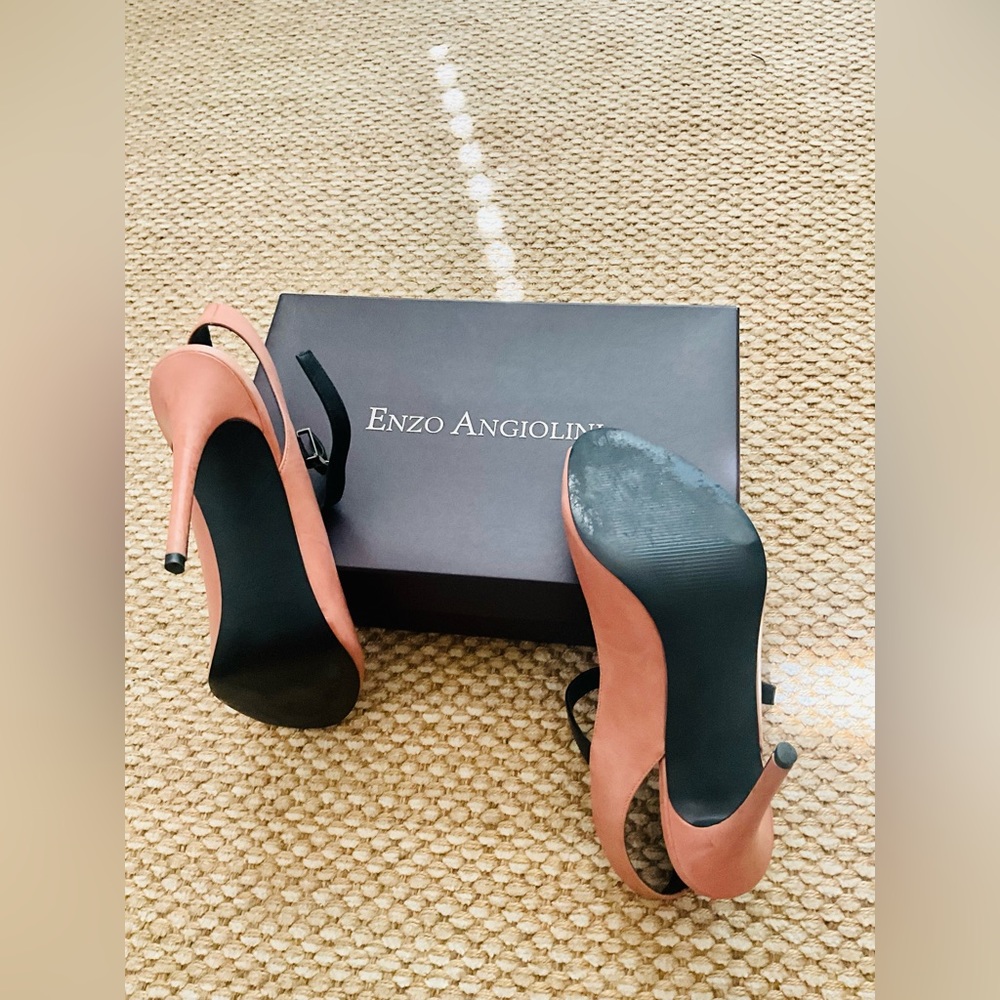 Coral color beautiful good condition Mary Jane straps peep toe and open heel.
